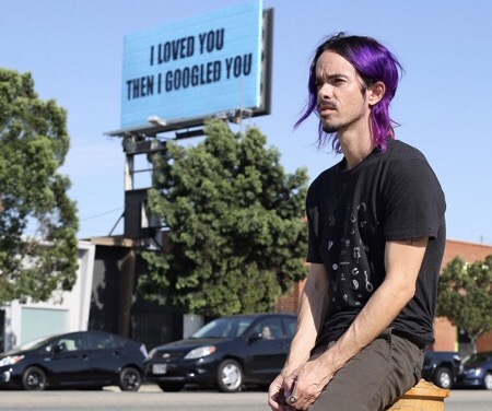 Adam Mars with I Love You billboard on LaCienega blvd.