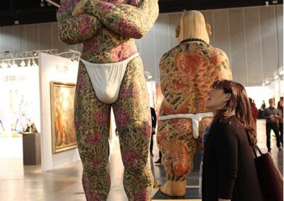 Janice Bremec Blum gets an close up view of the tattoos on sumo wrestlers - LA Art Show 2020