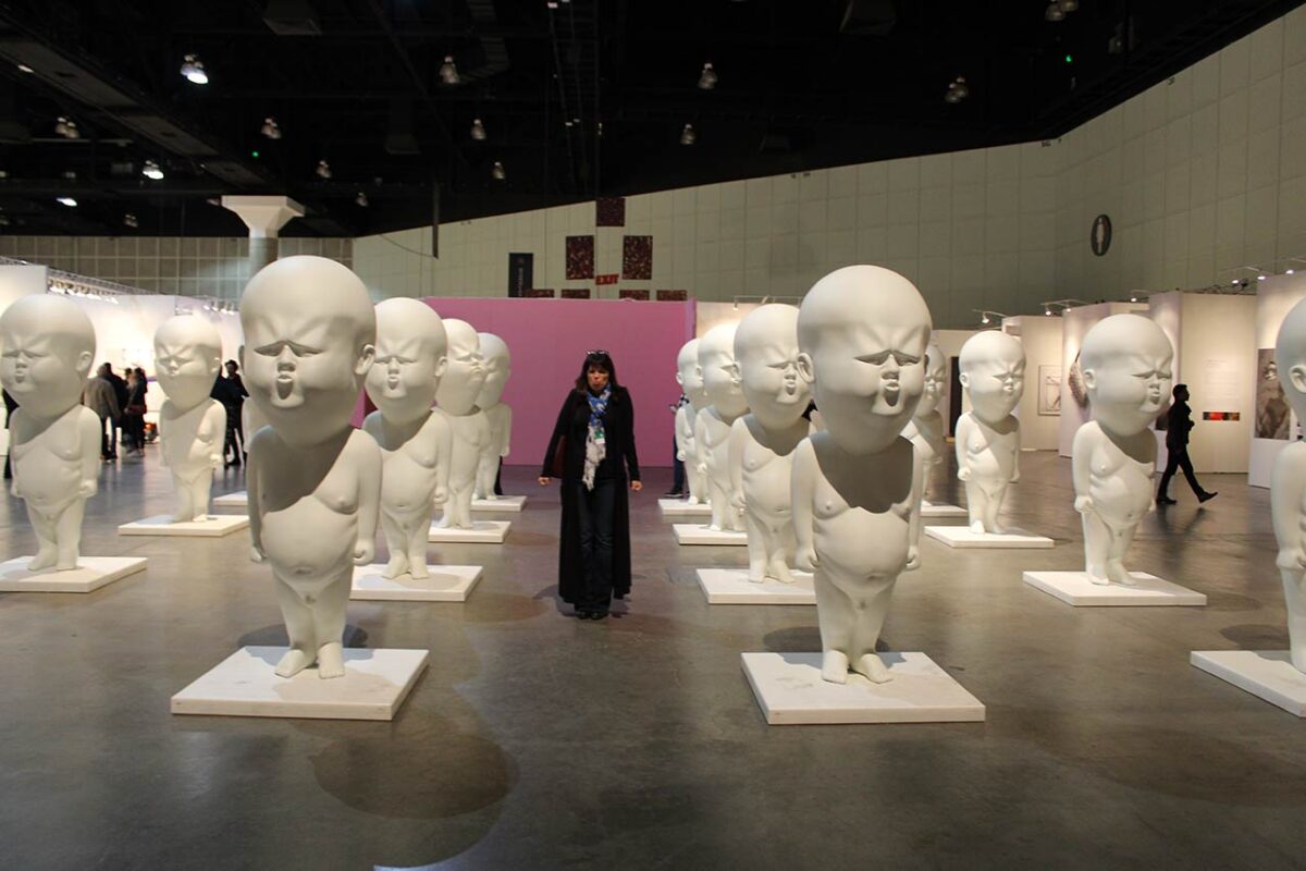Janice Bremec Blum with Trump statutes at LA Art Show